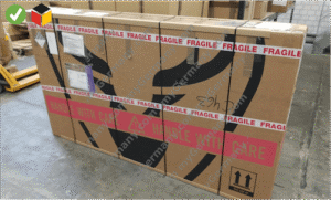 sealed fragile-labeled cardboard bike box ready for shipment